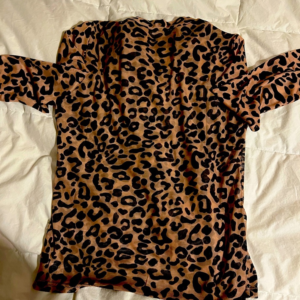 Turtle neck sheer shirt size xl fits like a large